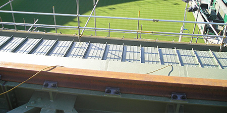 Retractable stadium roof rails